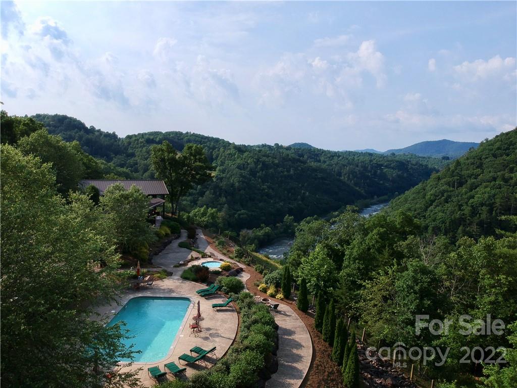 Relax by the pool while taking in the peaceful scenery! - 921 Wild River Run, Marshall