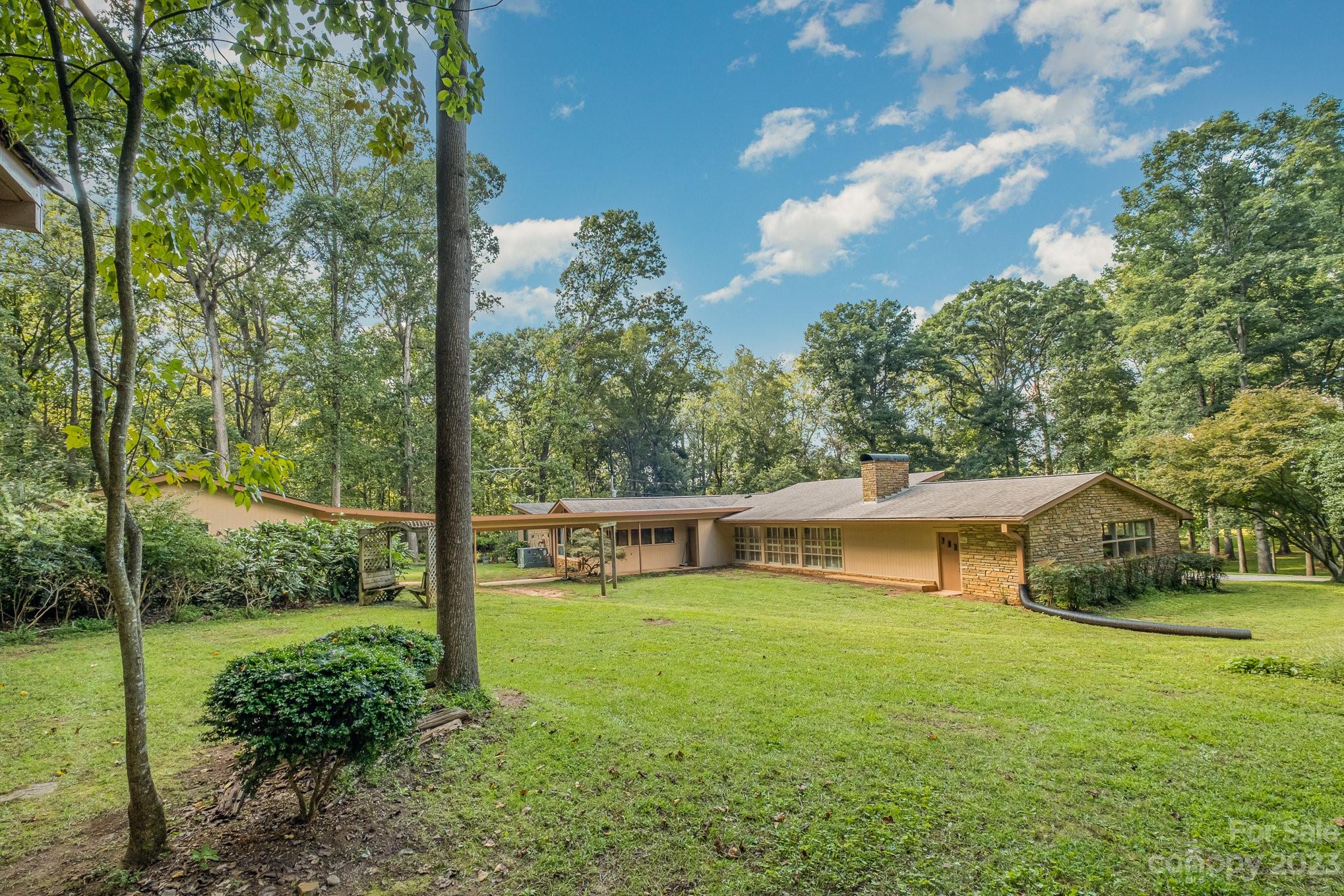 View of back of home.  The door on the right leads to an extra room that could be finished behind garage. - 2756 Peachtree Road, Statesville