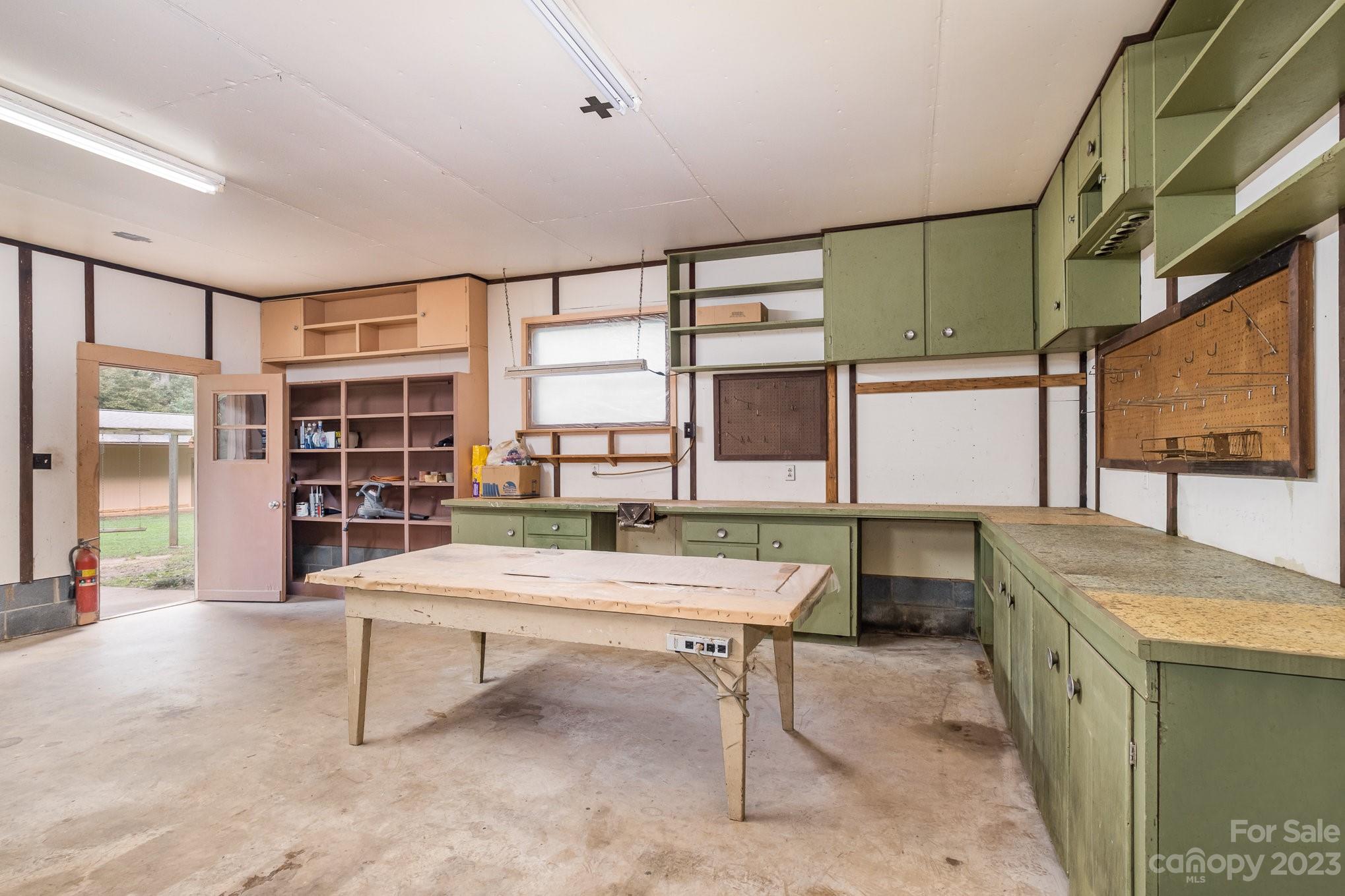 This incredible shop can be a shop but also possibly a second residence although permitting would need to be checked but this building is plumbed and wired and large enough for living space. - 2756 Peachtree Road, Statesville