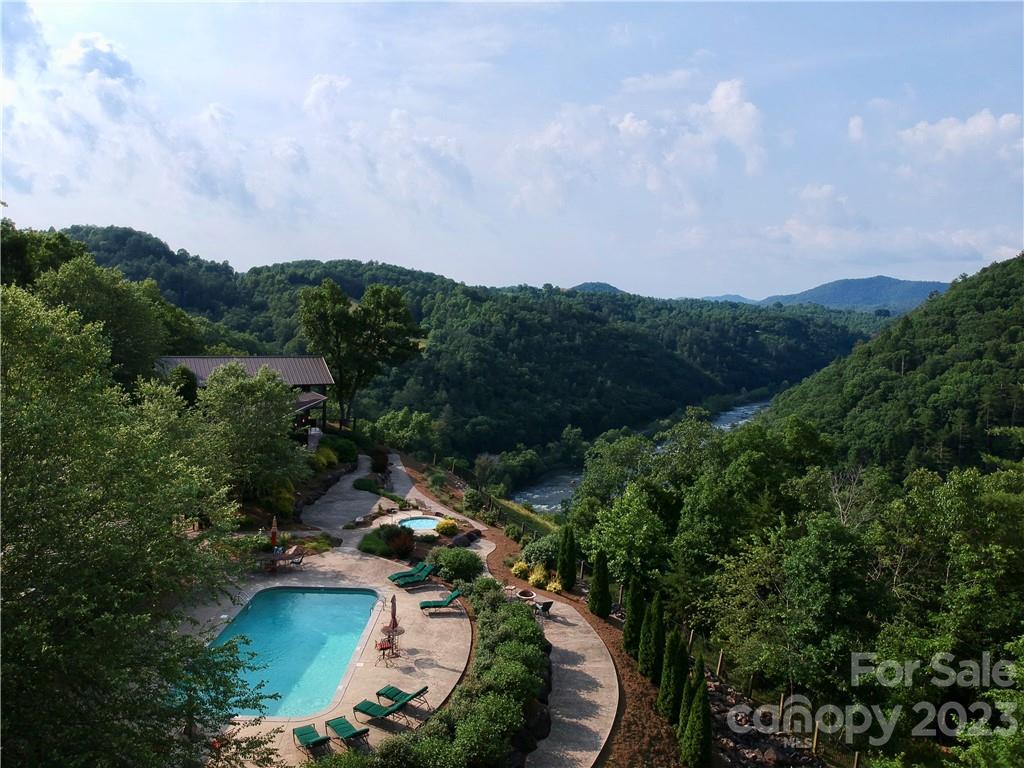 Relax by the pool while enjoying the peaceful surroundings! - 677 White Water Way, Marshall