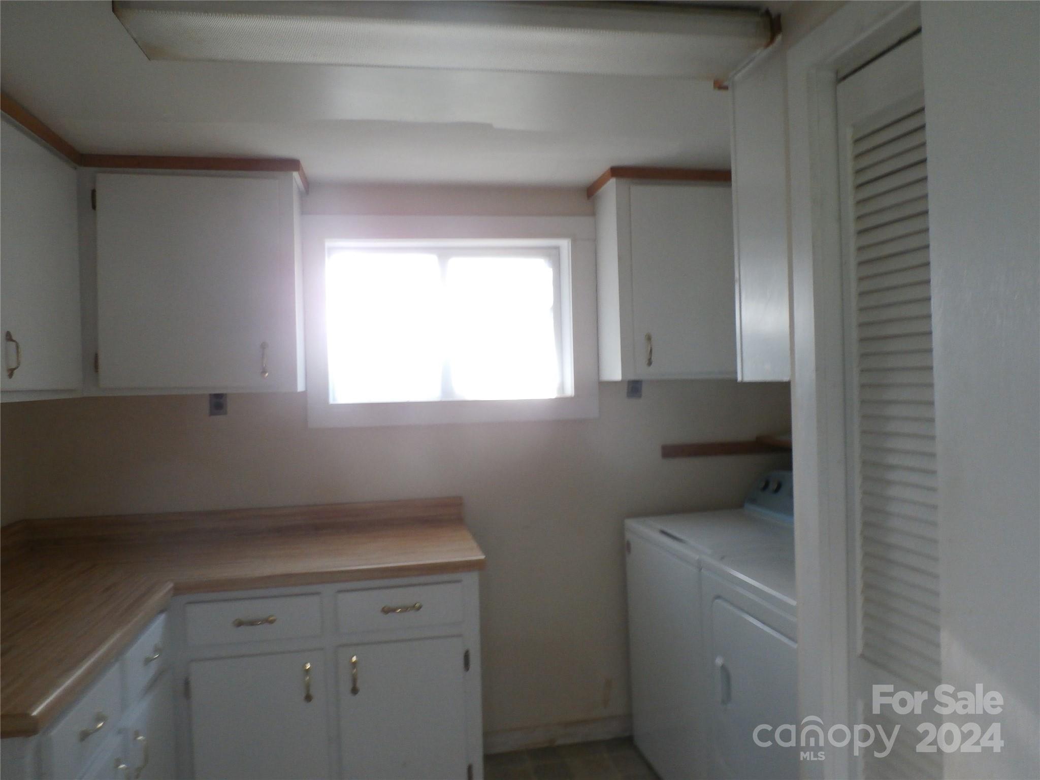 laundry room - 288 Firetower Road, Spruce Pine