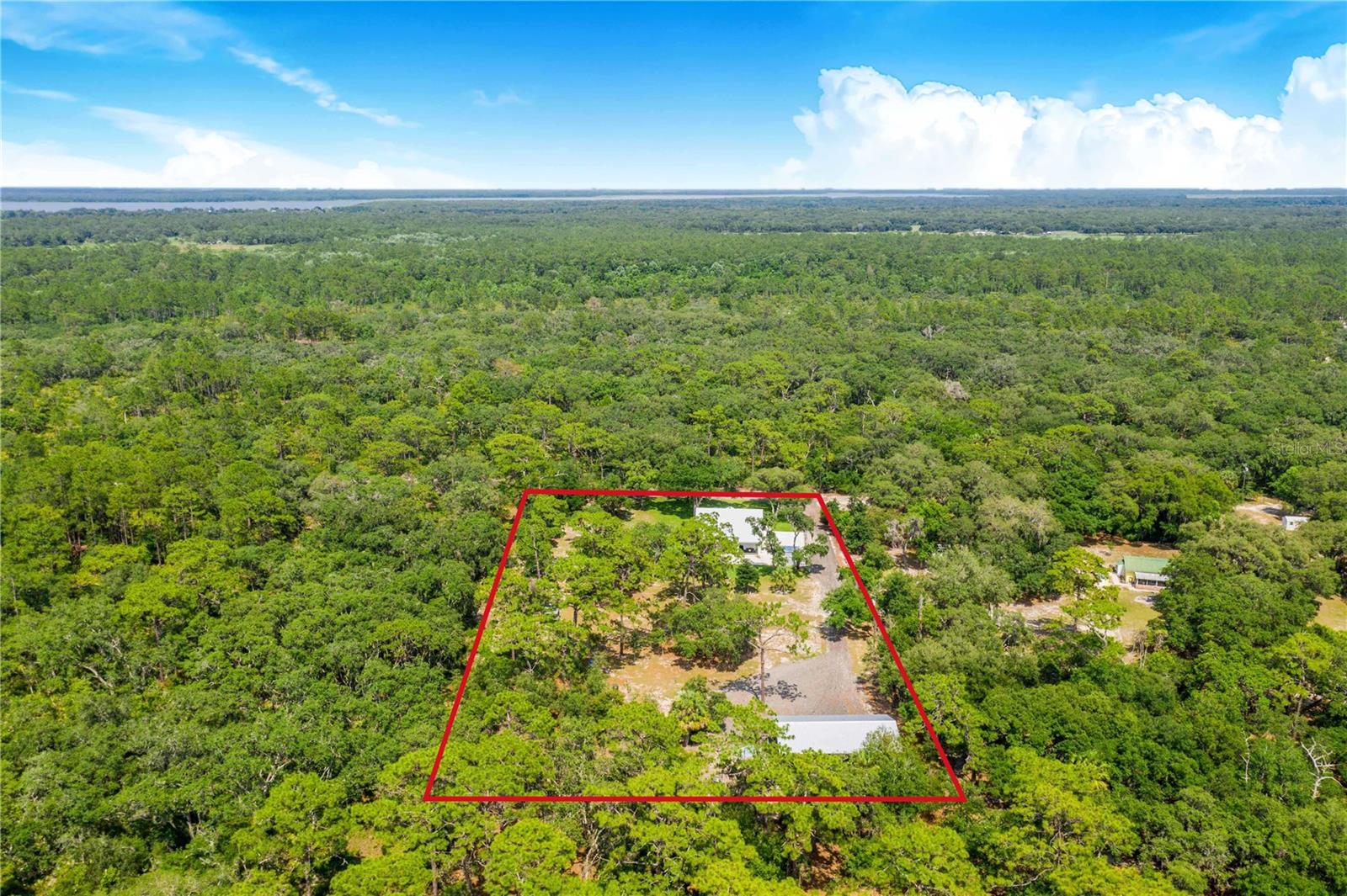 Surrounding Land Aerial View - 12510 LAKE HATCHINEHA RD, HAINES CITY