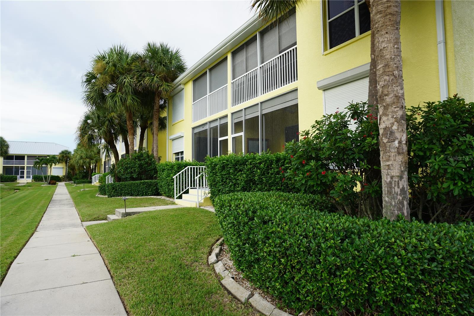 Sidewalk towards pool/spa and BBQ area - 2000 BAL HARBOR BLVD #1012, PUNTA GORDA
