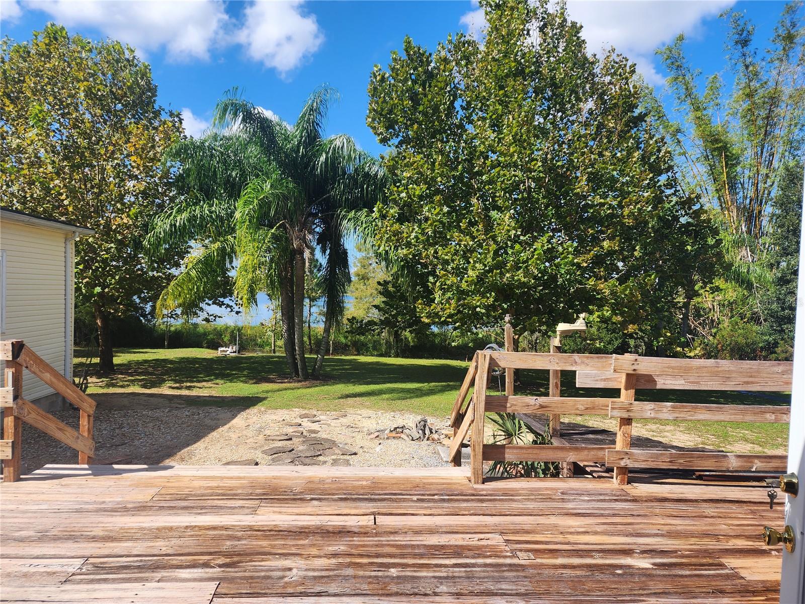 REAR DECK AREA OVERLOOKING THE LAKE - 14902 ARRENA RD, WINTER GARDEN
