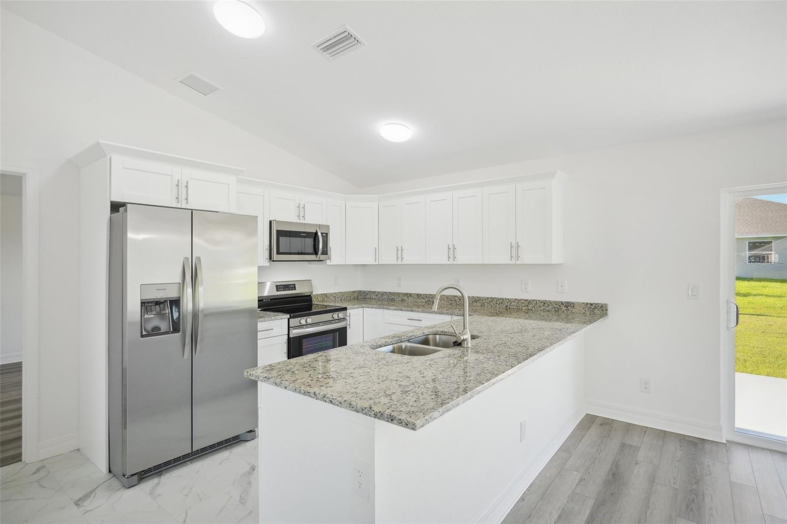 Kitchen view - 11145 2ND AVE, PUNTA GORDA