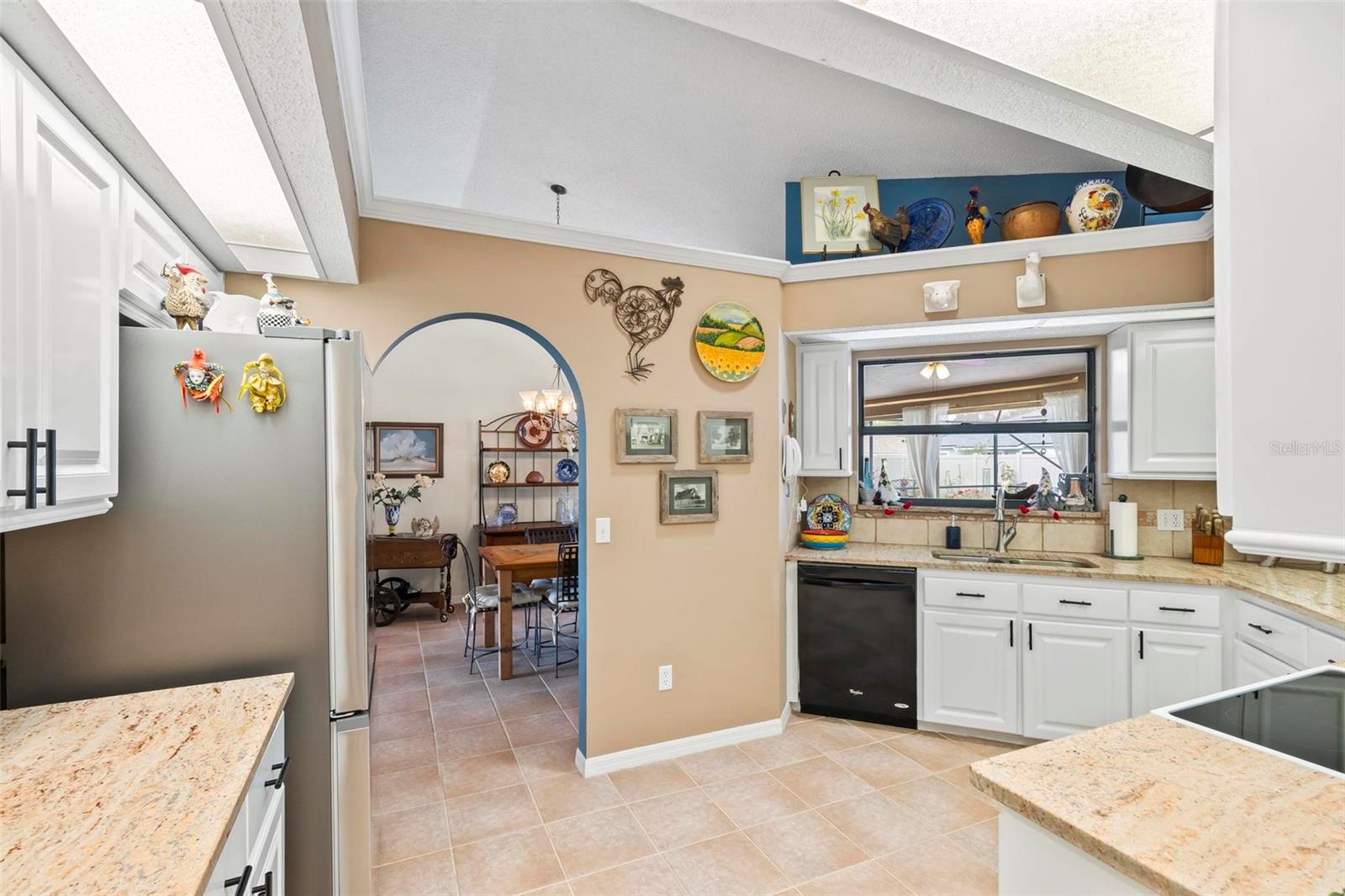 KItchen open to Dining Room - 130 BAYSIDE DR, PALM COAST