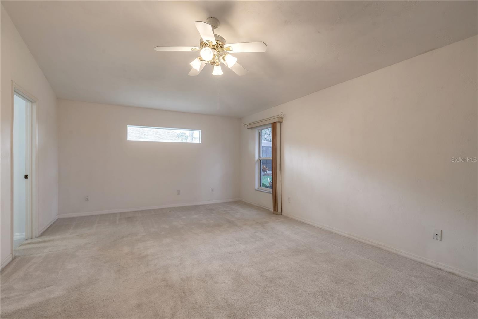 Elegant primary bedroom - 2626 TURNBULL ESTATES DR, NEW SMYRNA BEACH