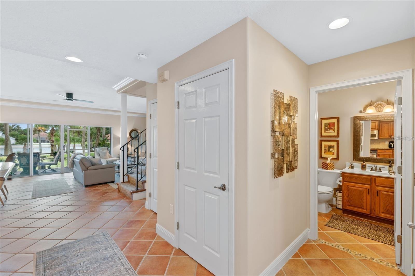 Hallway/1st flr bathroom/garage entry - 50 PALM HARBOR PKWY #32, PALM COAST