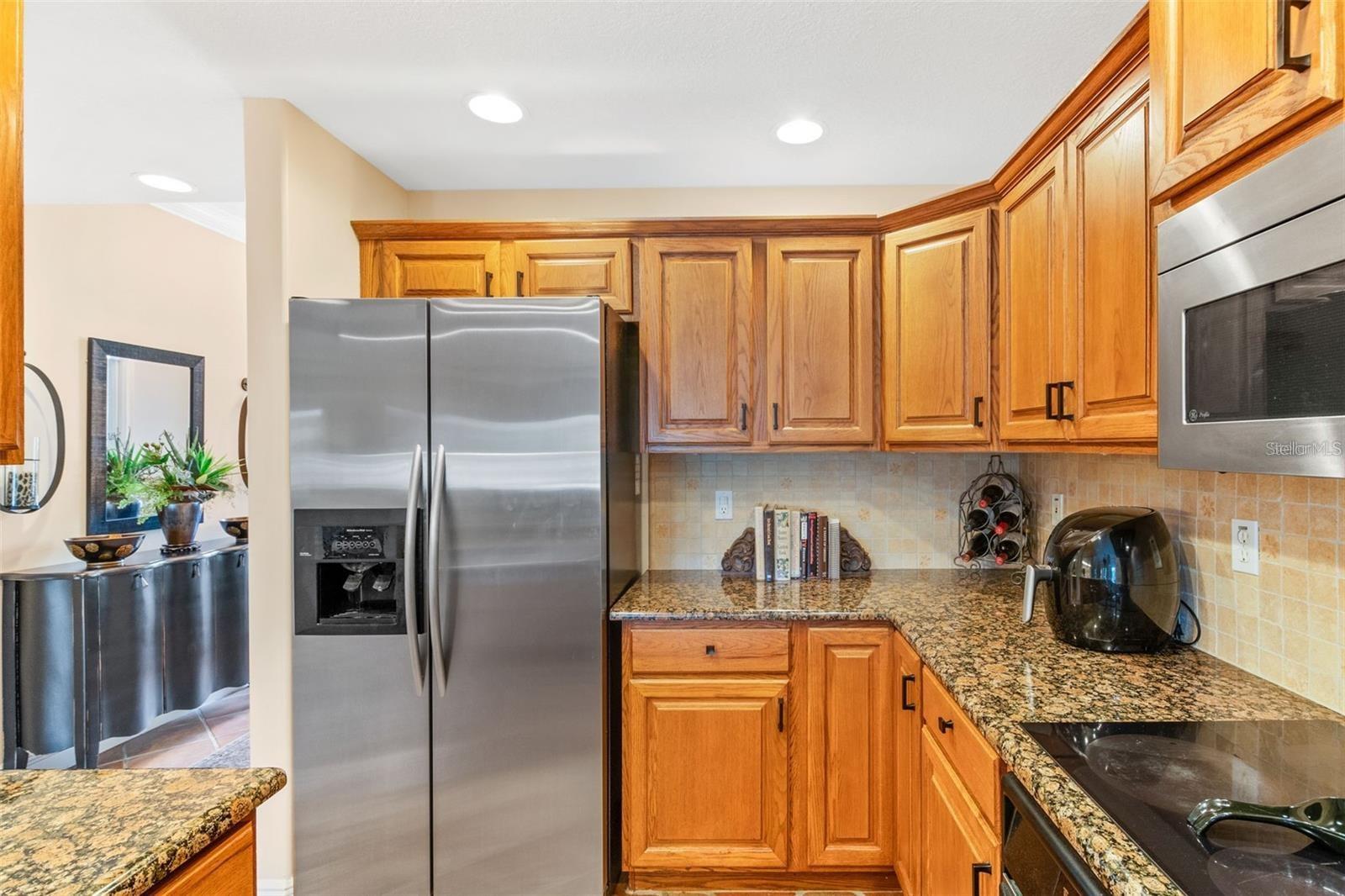 Kitchen with granite counter tops - 50 PALM HARBOR PKWY #32, PALM COAST