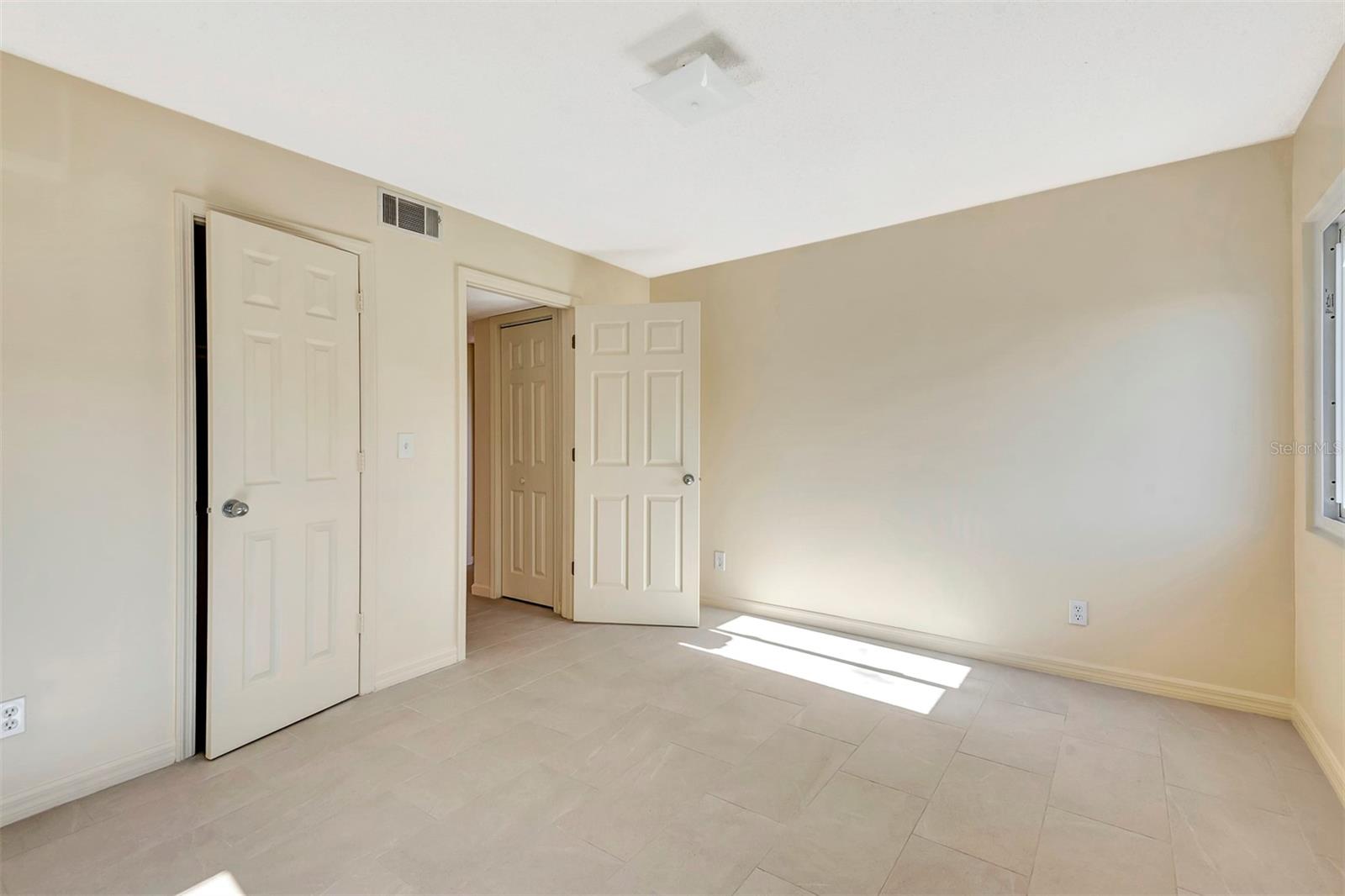 Primary Bedroom - 48 CLUB HOUSE DR #106, PALM COAST