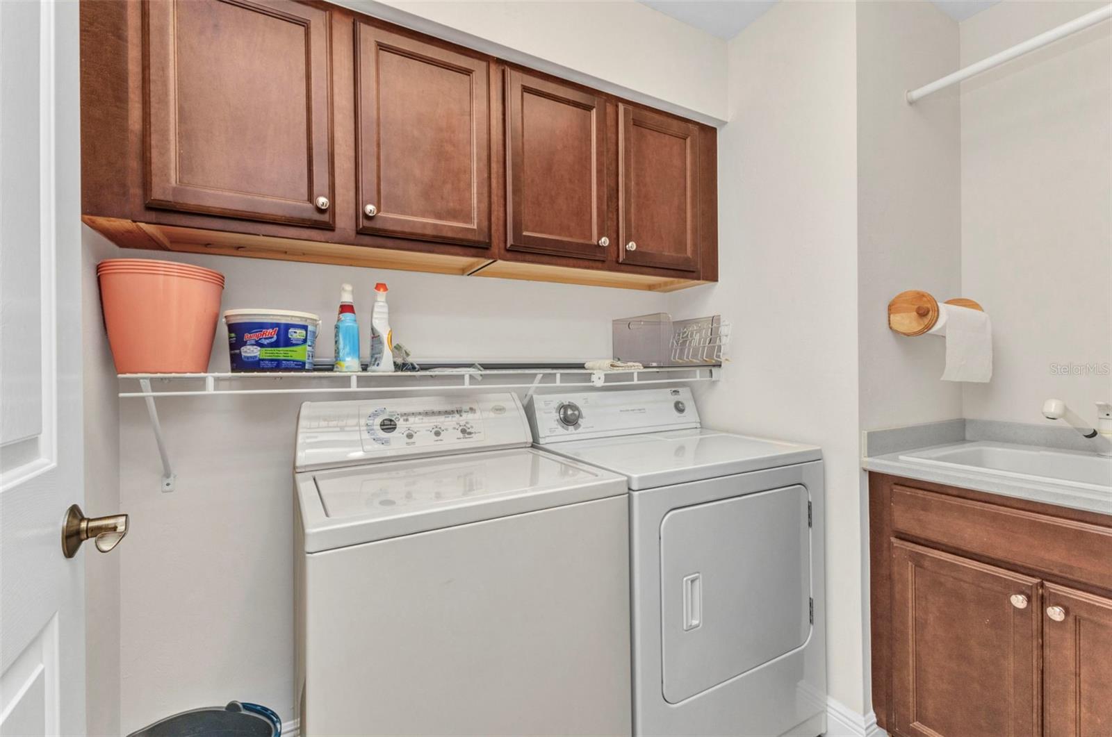 Laundry room with storage cabinets and sink - 3321 SUNSET KEY CIR #502, PUNTA GORDA