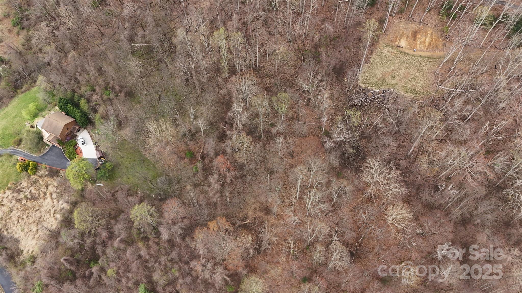 Looking down on the lot. Cleared area is lot of above. - 380 Serenity Mountain Lane, Mars Hill