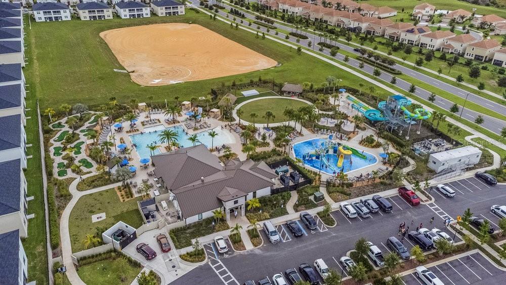 Aerial view of  community pool with water park at Oasis Clubhouse - 1148 KINGSBARN ST, DAVENPORT