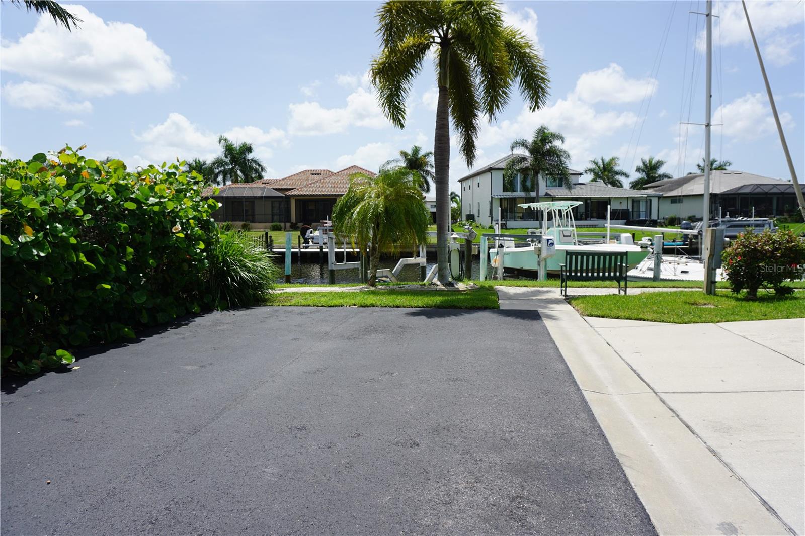 View from driveway to where the boat dock/lift are at end of street - 2000 BAL HARBOR BLVD #1012, PUNTA GORDA