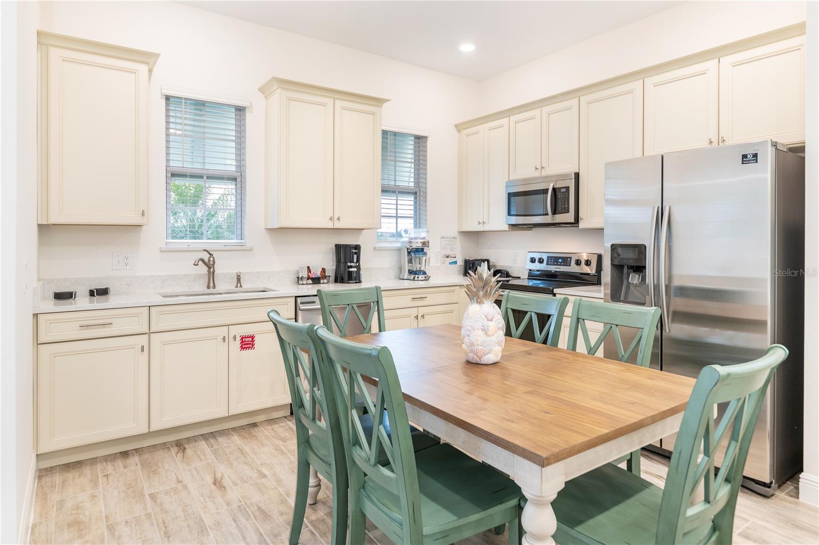 Upgraded kitchen with ample cabinetry and stainless appliances in Kissimmee vacation home - 2988 SALTED RIM RD, KISSIMMEE