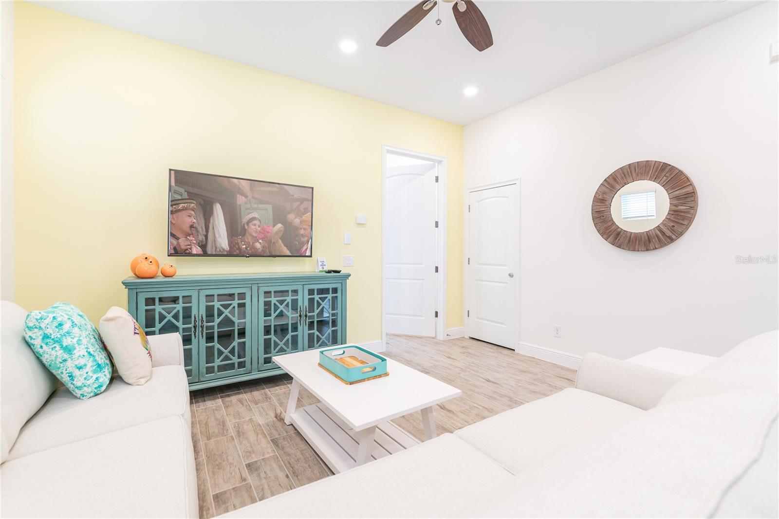 Spacious living area with coastal décor and tile flooring in Kissimmee short term rental - 2988 SALTED RIM RD, KISSIMMEE