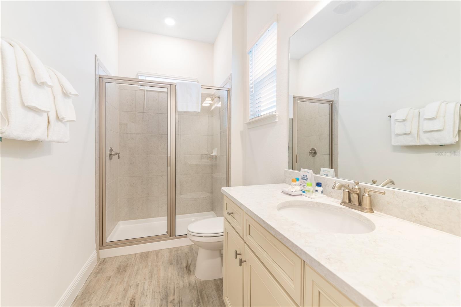 Clean and spacious primary bath with modern finishes in Margaritaville Resort Orlando - 2988 SALTED RIM RD, KISSIMMEE