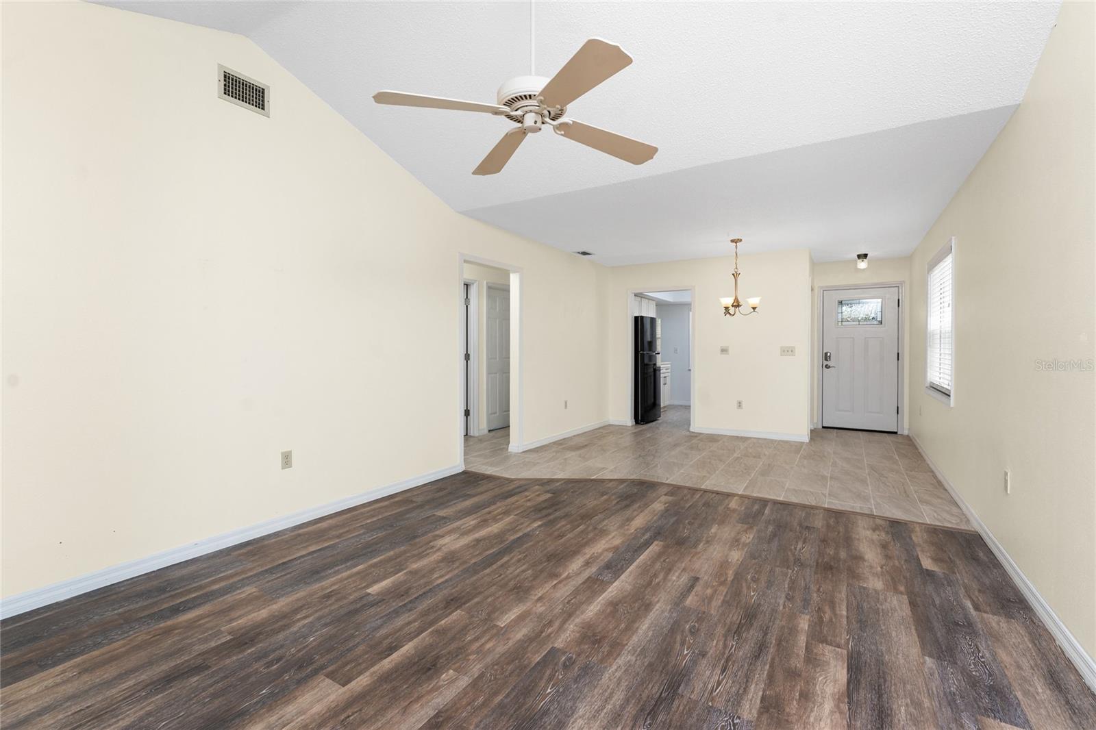 Main living area has updated laminate flooring. - 6796 GASPARILLA PINES BLVD #63, ENGLEWOOD