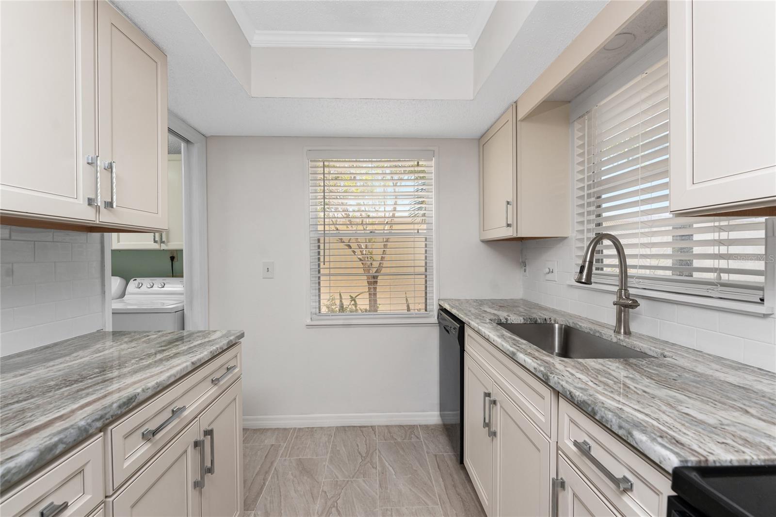 Kitchen has very stylish raised face cabinetry and granite countertops - 6796 GASPARILLA PINES BLVD #63, ENGLEWOOD