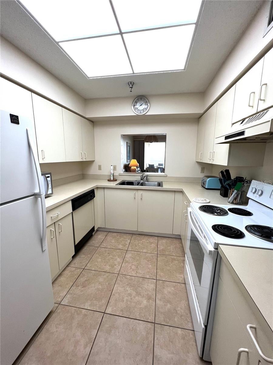 Kitchen with pass through giving views to Balcony - 104 SURFVIEW DR #2503, PALM COAST