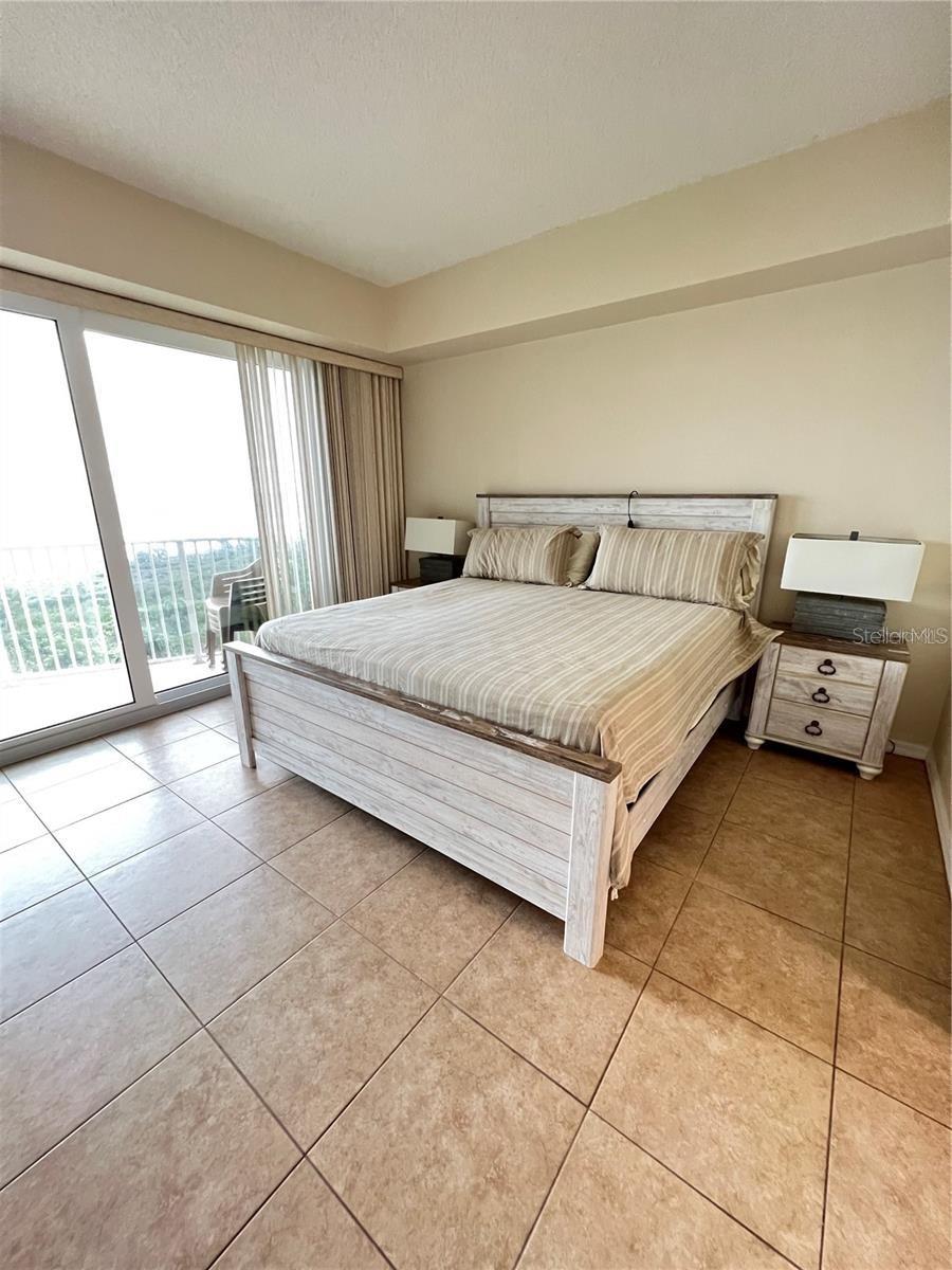 Primary Bedroom-King bed-sliders to balcony, two walk-in closets. Ensuite bathroom - 104 SURFVIEW DR #2503, PALM COAST