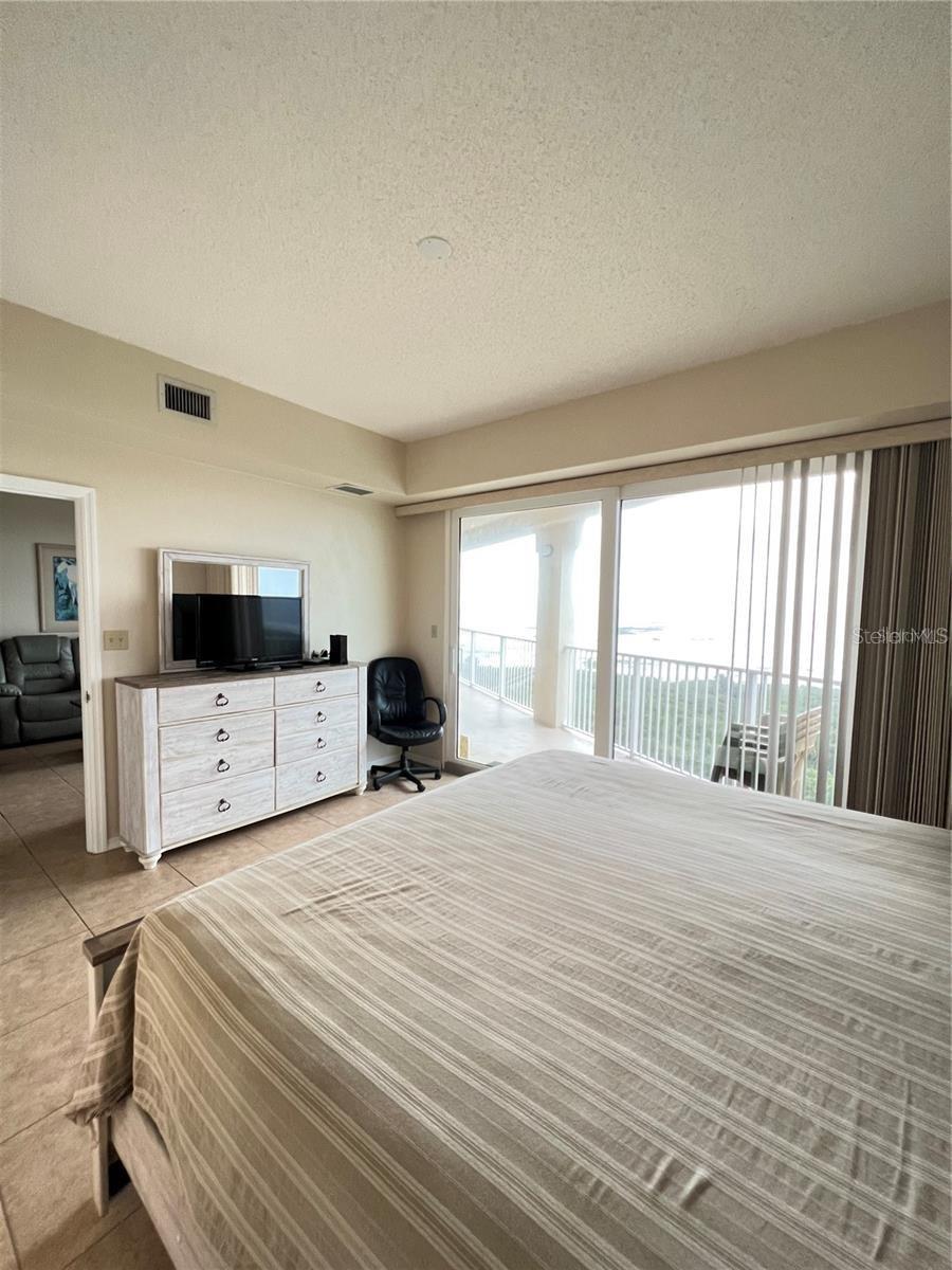 rimary Bedroom-King bed-sliders to balcony. Ensuite bathroom - 104 SURFVIEW DR #2503, PALM COAST