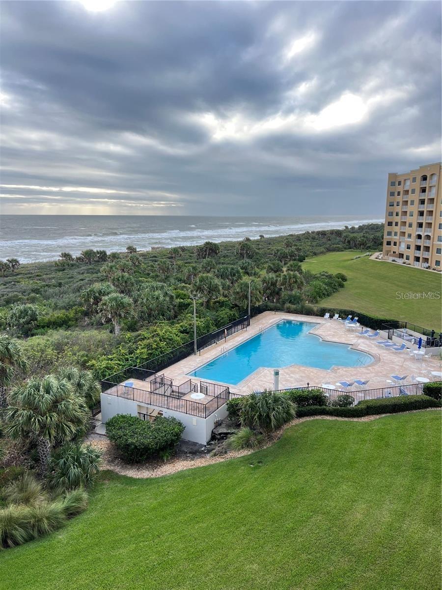 View from balcony to heated oceanfront pool - 104 SURFVIEW DR #2503, PALM COAST