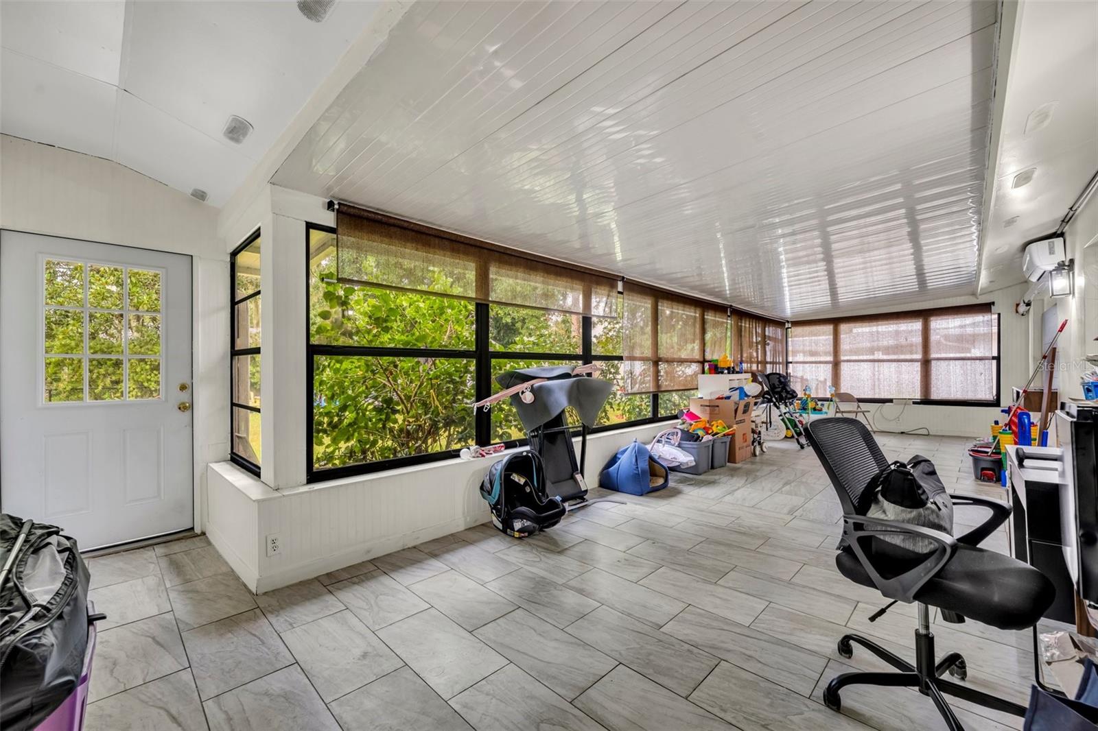 enclosed Florida room - 40 BLARE DR, PALM COAST