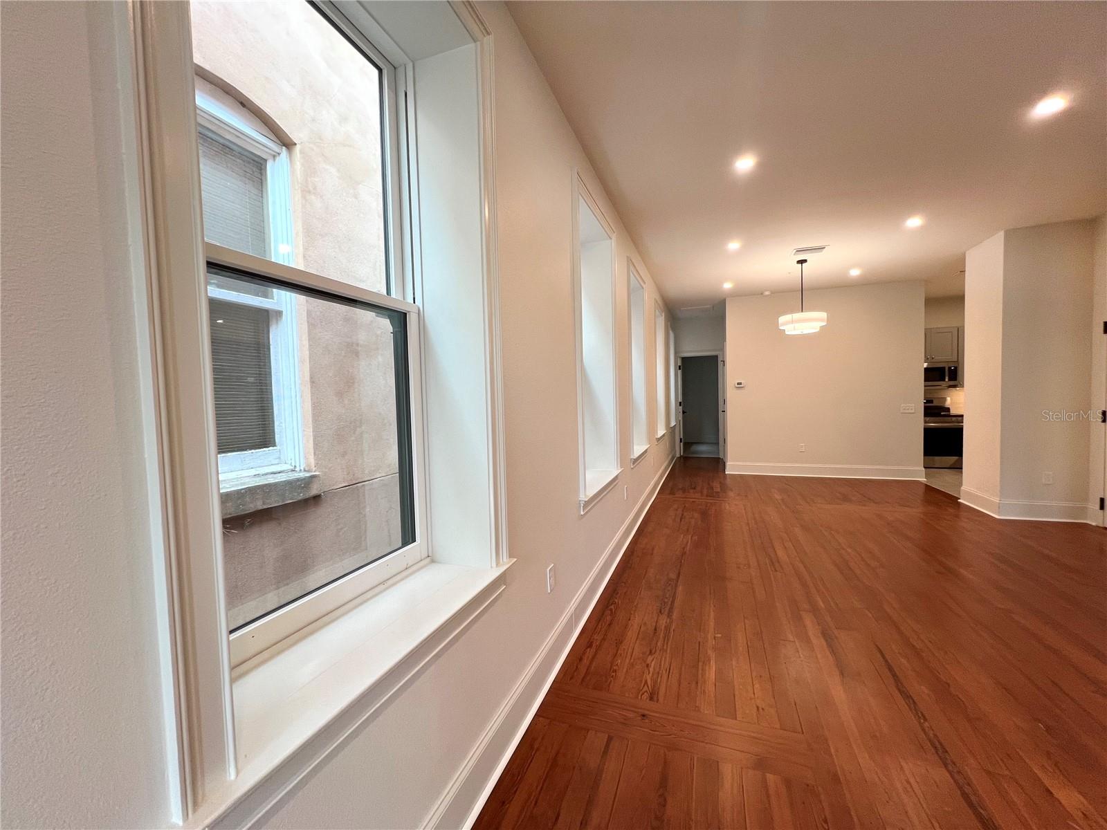 Unit 201 Living Room looking towards kitchen - 244 E PARK AVE, LAKE WALES