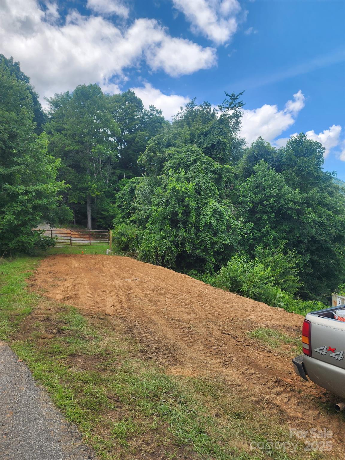 Lot continues past red gate to center of Whispering Wind Rd to above ground elec - 38 Rons Ridge, Waynesville