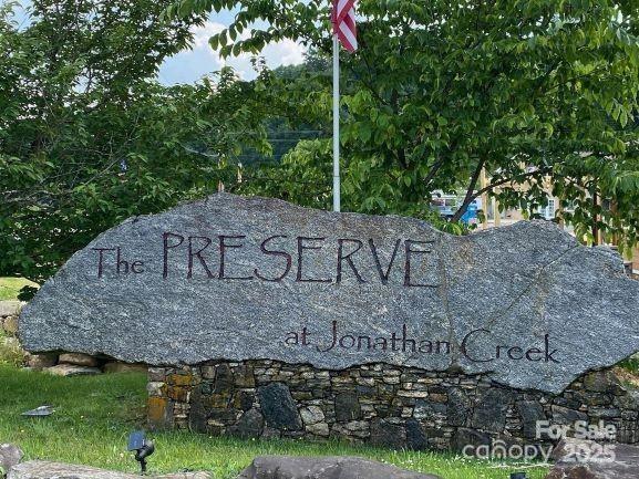 Sign with American flag pole - 35 Rons Ridge, Waynesville