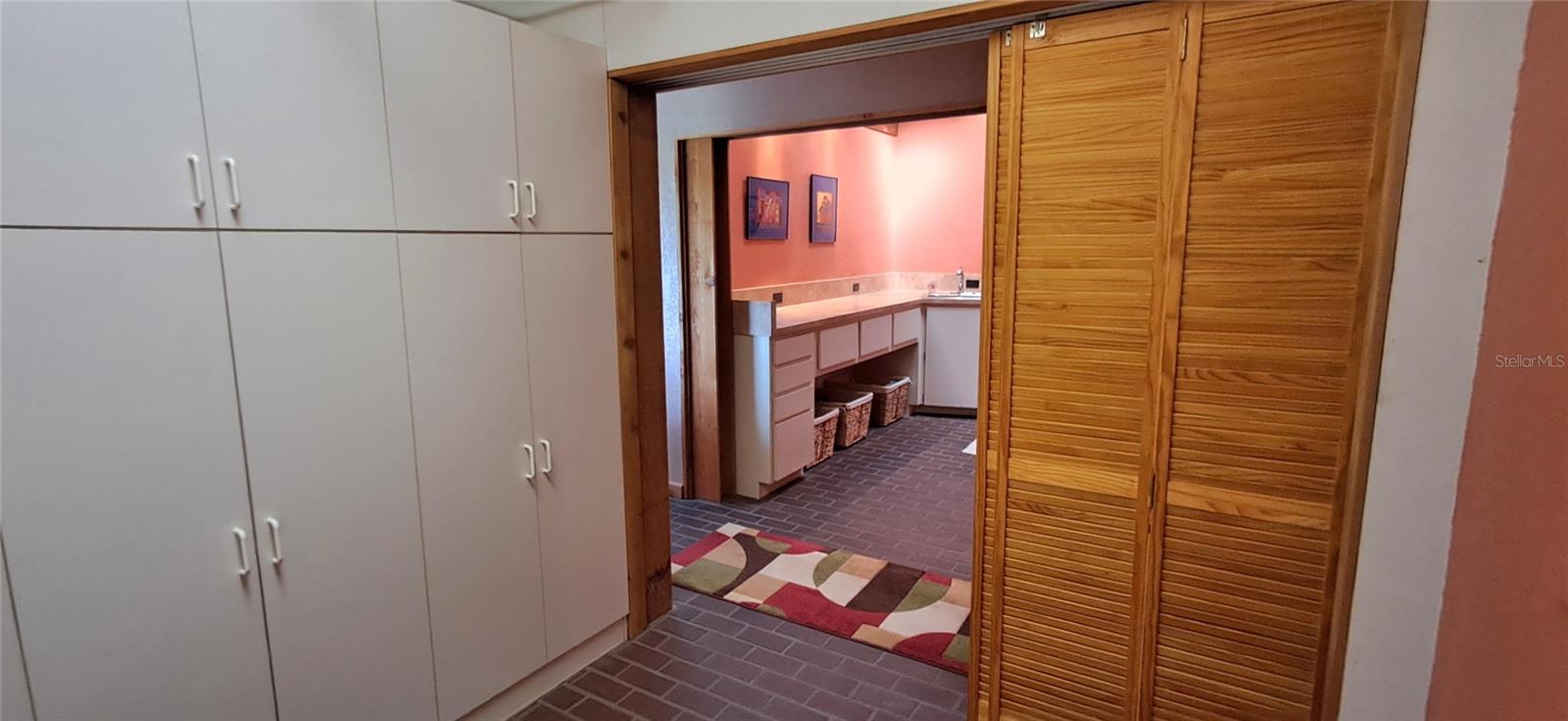 Walk-In Pantry with lots of storage, view to the Laundry Room - 2741 EDWARDS RD, HAINES CITY