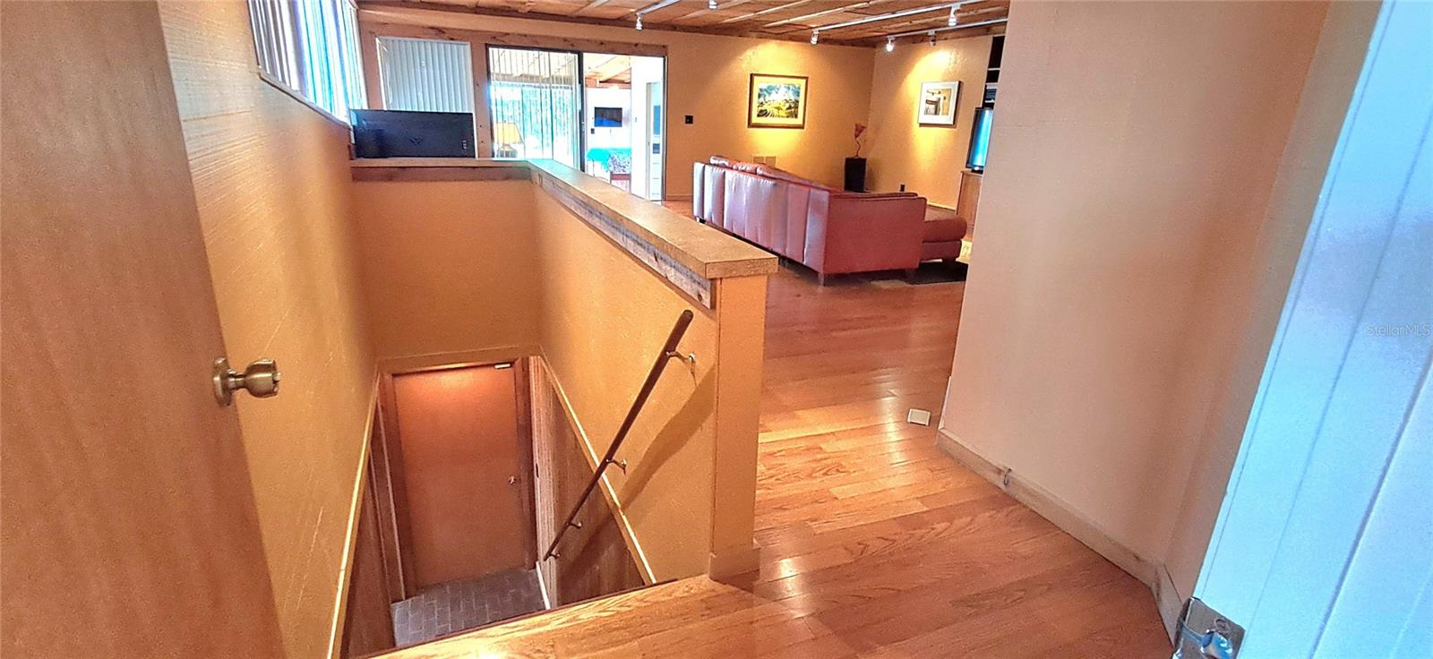 2nd set of Stairs off of the Family Room that leads to 1st Floor Guest Bedroom area - 2741 EDWARDS RD, HAINES CITY