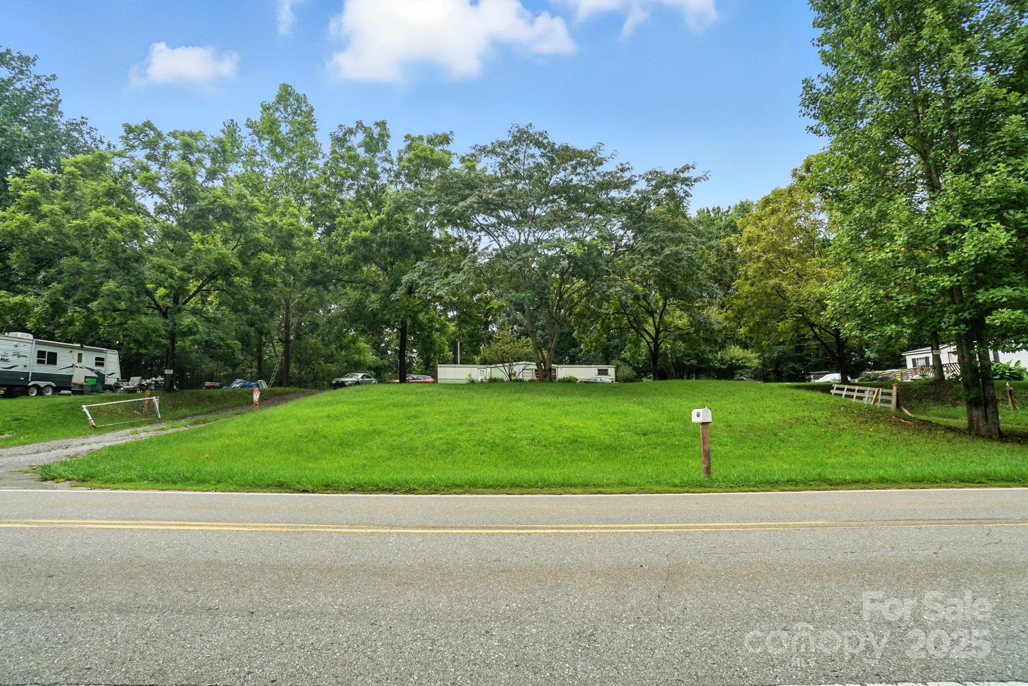 View of the front lot of subject from across street - 450 Dixon School Road, Kings Mountain