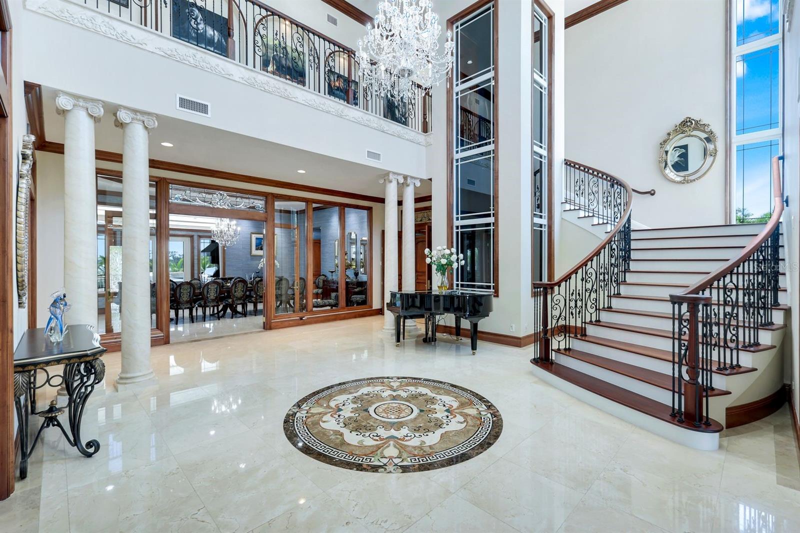 Foyer with glass elevator and staircase - 7159 MANASOTA KEY RD, ENGLEWOOD