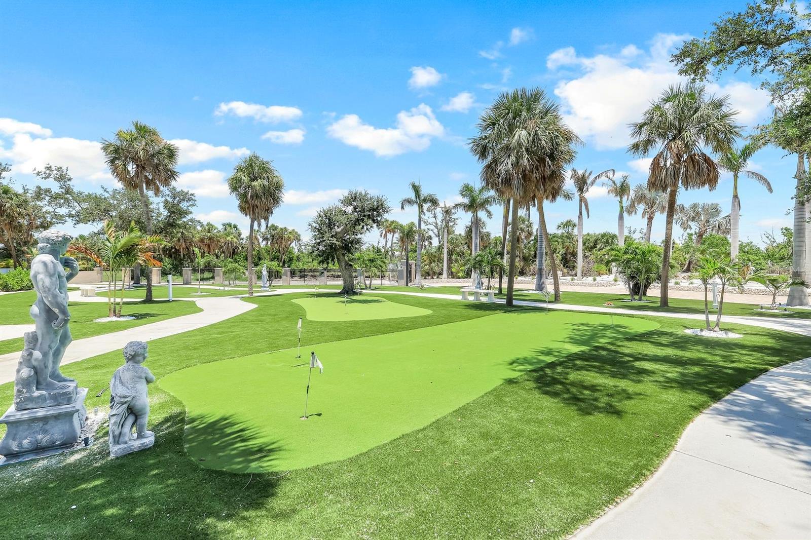 Putting greens stunning landscaping - 7159 MANASOTA KEY RD, ENGLEWOOD