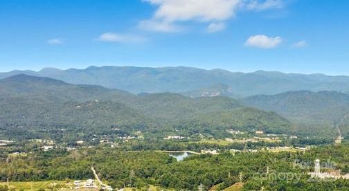 Come build your dream home here and experience Blue Ridge mountain views potential from your 14.97-acre homesite looking towards the iconic Looking Glass Rock in Pisgah National Forest. The sunsets will be amazing. - 11 Reserve Road, Pisgah Forest
