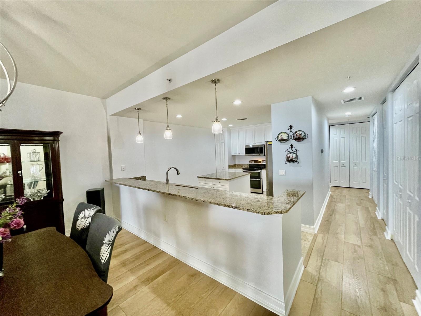 Hallway to guest side of the unit has many closets - 85 VIVANTE BLVD #8534, PUNTA GORDA