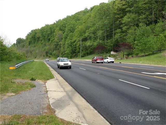 View of site clearance toward Ahseville from one of two entrances with center lane for ease of access. - 10 acres Charlotte Highway, Asheville