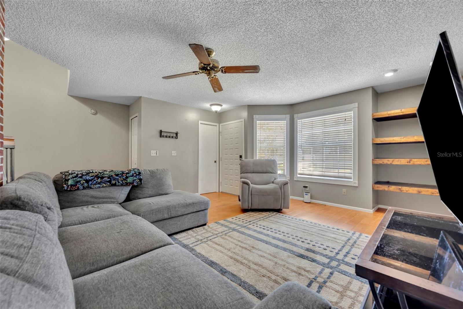 The downstairs half bath and adjacent storage closet is a big convenience - 2810 CORNERSTONE CT, APOPKA