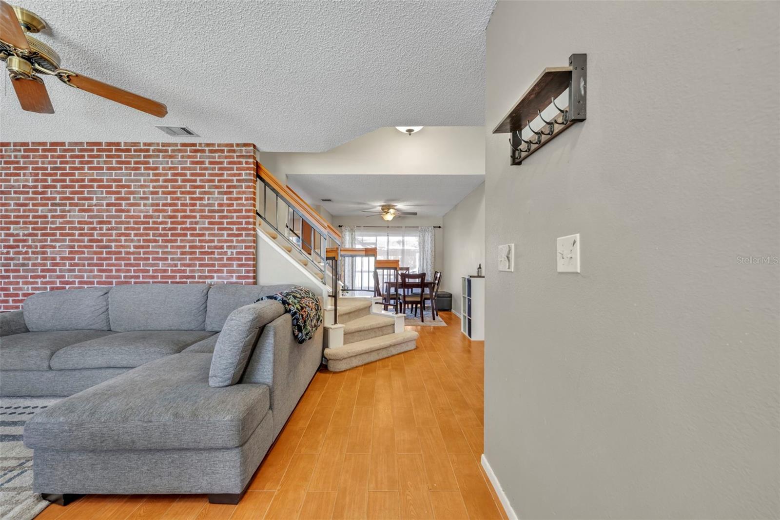 Entryway and living room flow nicely to the dining room and eat in kitchen. - 2810 CORNERSTONE CT, APOPKA