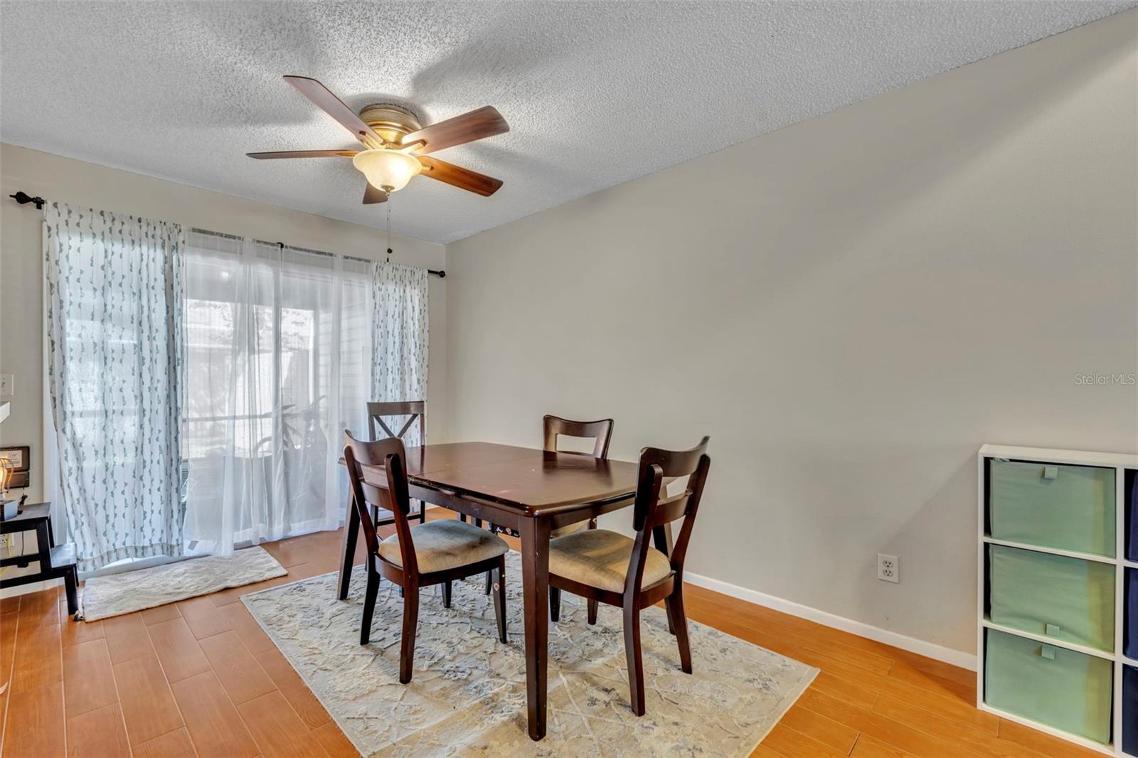 The dining room looks out onto the back screened in porch and your own backyard - 2810 CORNERSTONE CT, APOPKA