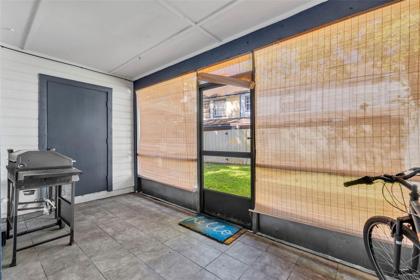 Screened in back porch with your private storage room. - 2810 CORNERSTONE CT, APOPKA