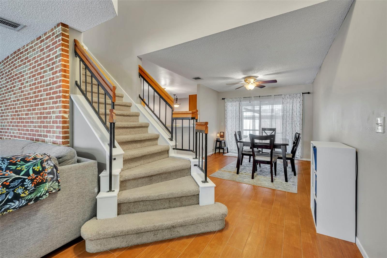 Beautiful staircase takes you to the double primary bedrooms. - 2810 CORNERSTONE CT, APOPKA