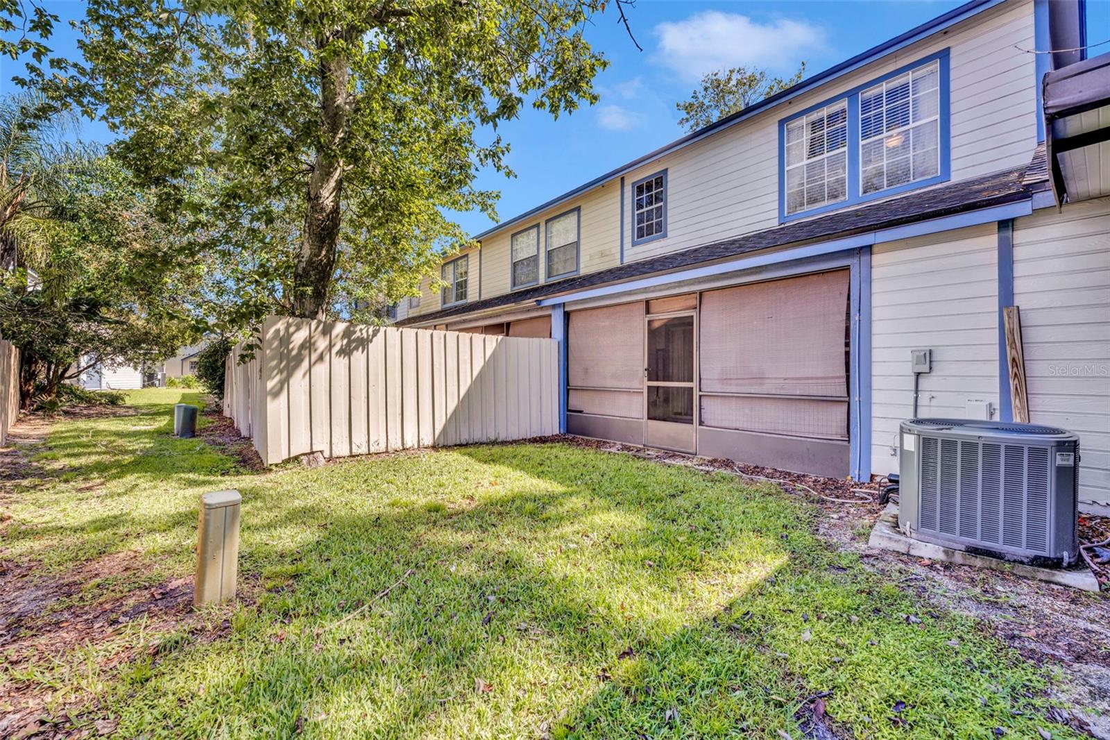 Screened in back porch. Note the almost new a/c unit. - 2810 CORNERSTONE CT, APOPKA