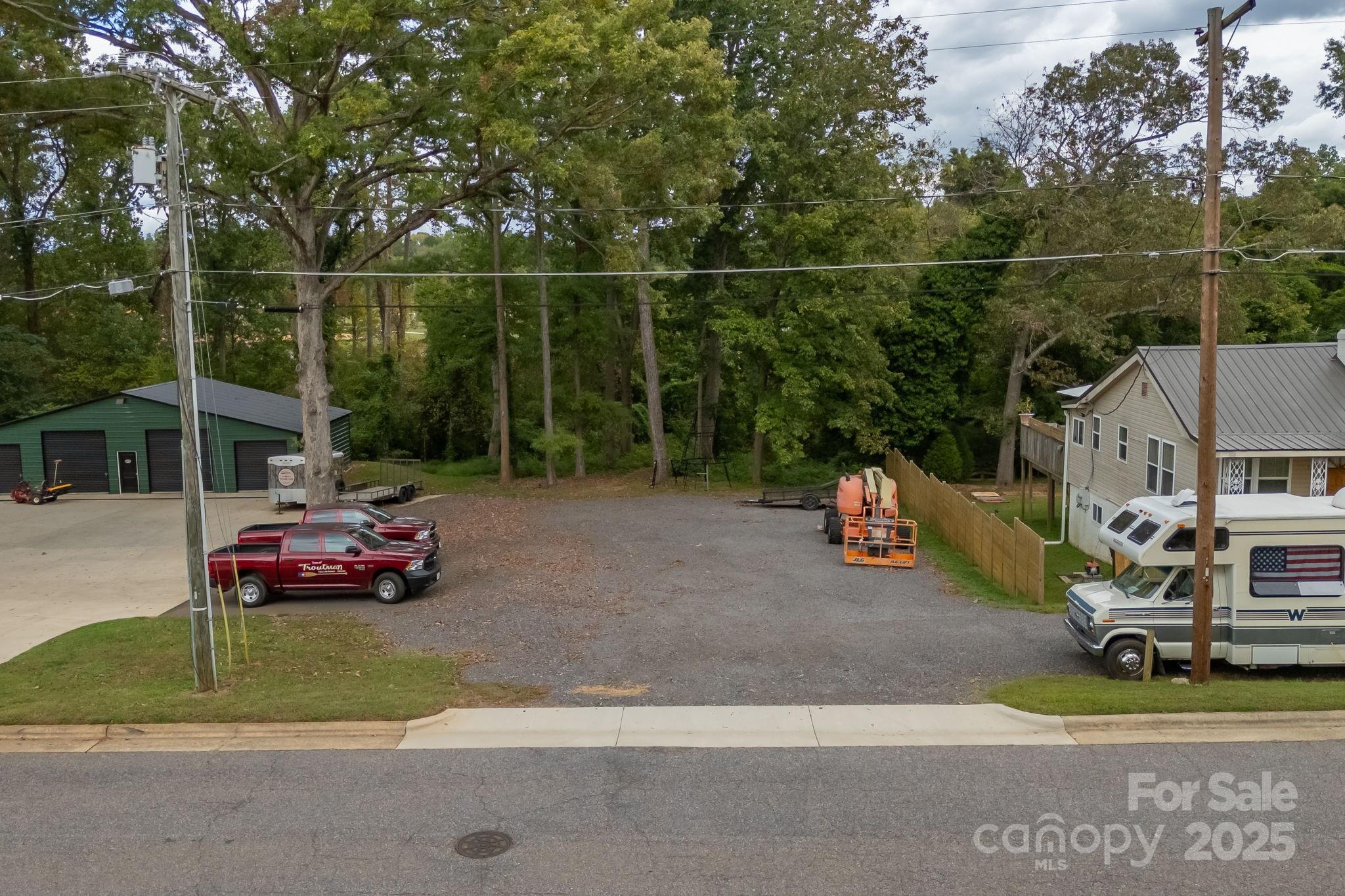 property line runs with the telephone line behind the home with RV. - 0 Bradburn Street, Troutman