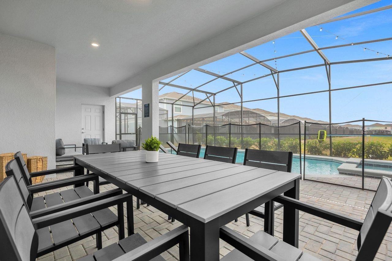 Outdoor - Covered patio with dining table, summer kitchen and conversation set - 3048 MAHALO DR, DAVENPORT