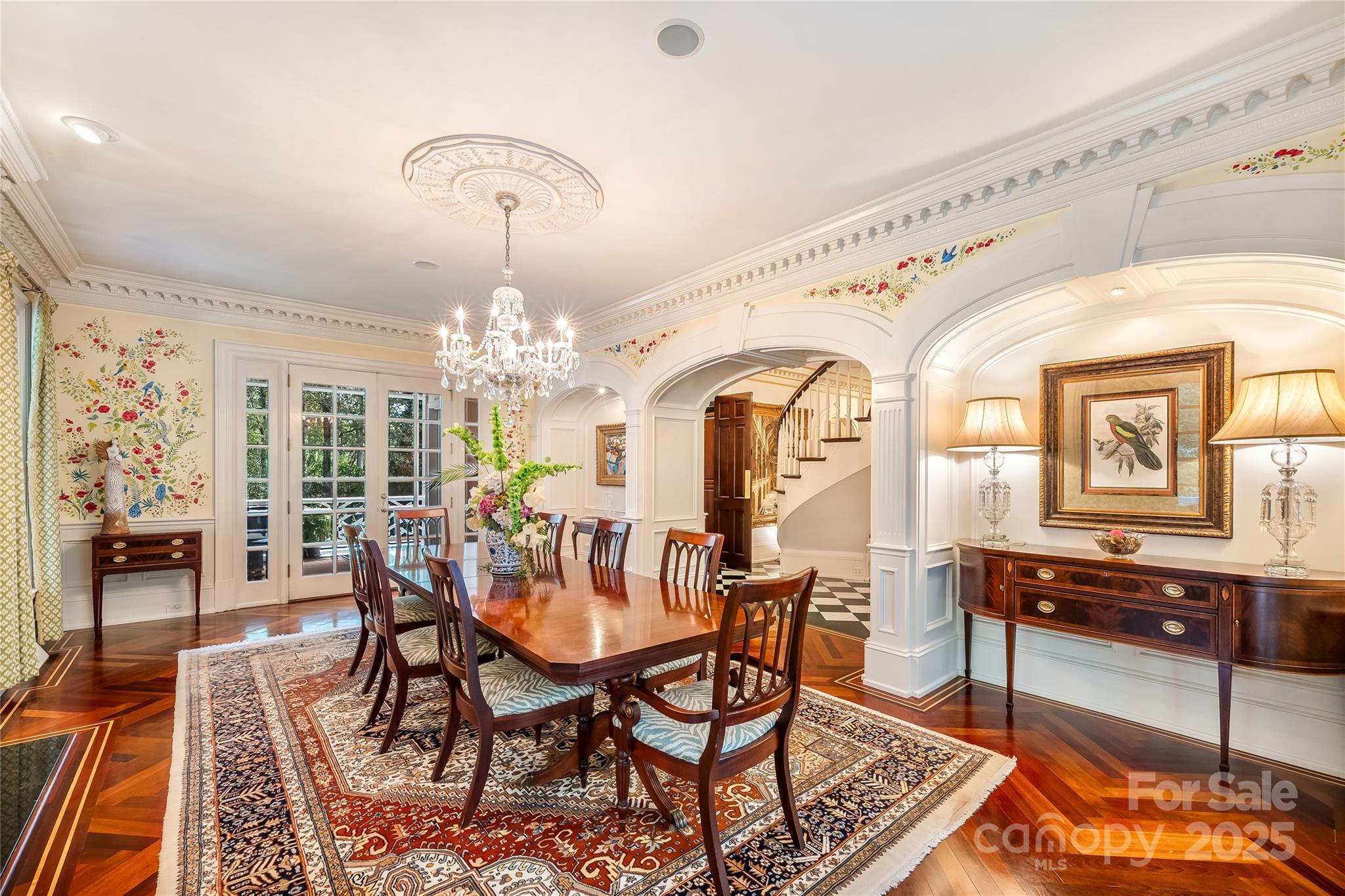Formal dining room with hand painted walls and direct access to the covered porches. - 2665 Rolling Hills Drive, Monroe