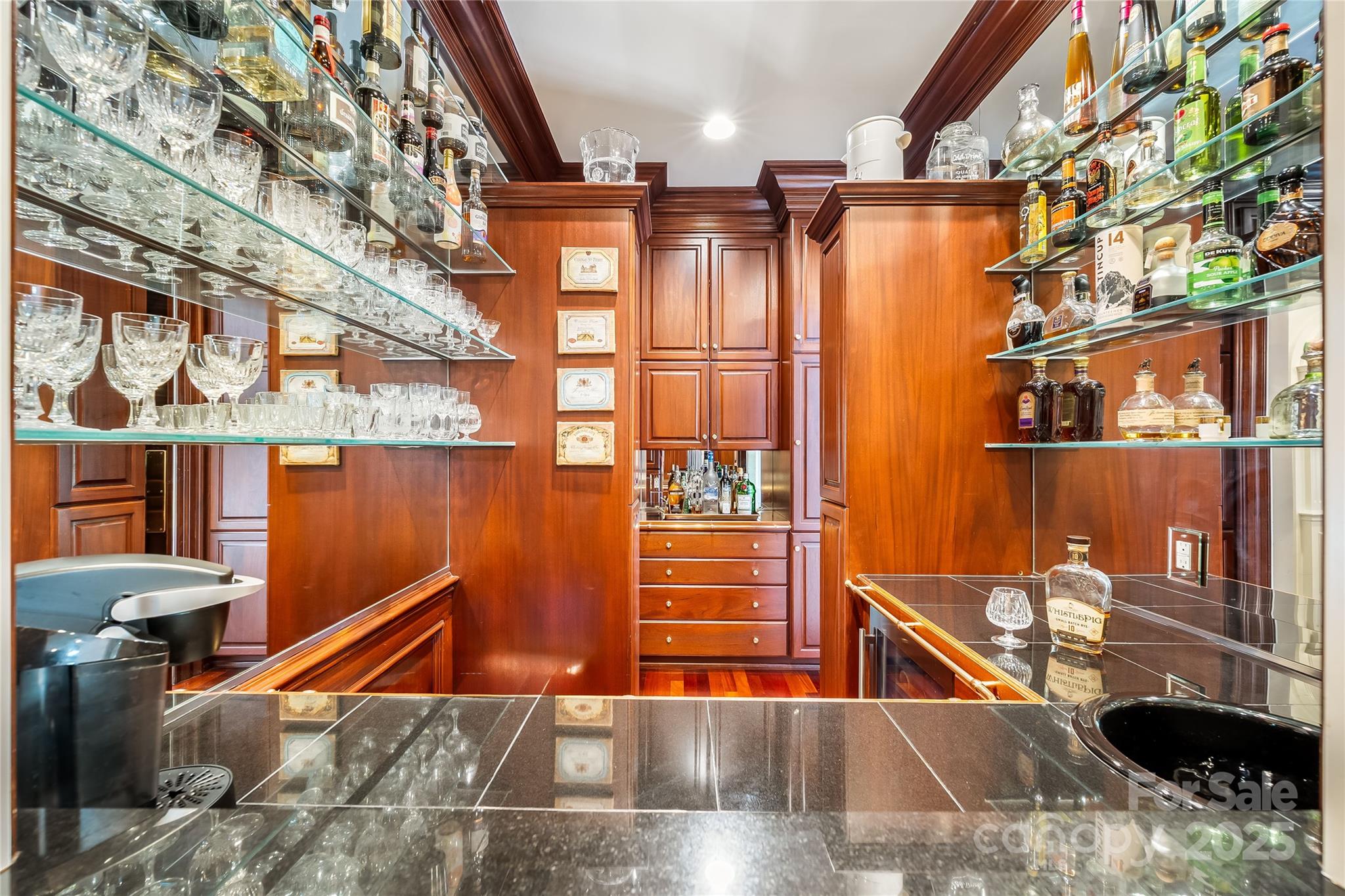 Centrally showcased wet bar with ample storage. - 2665 Rolling Hills Drive, Monroe