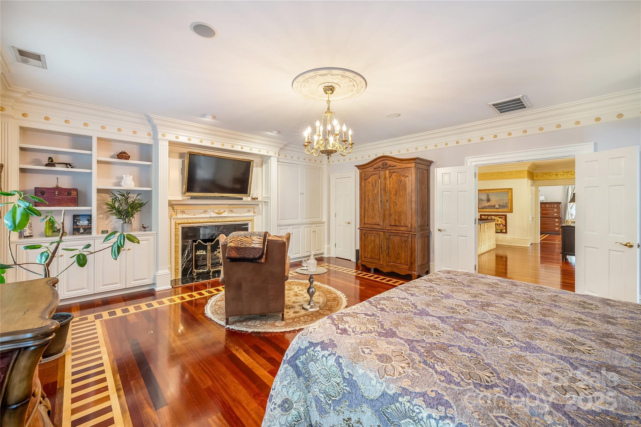 In laid hardwood flooring, custom mill work and fireplace details continue into the suites. - 2665 Rolling Hills Drive, Monroe